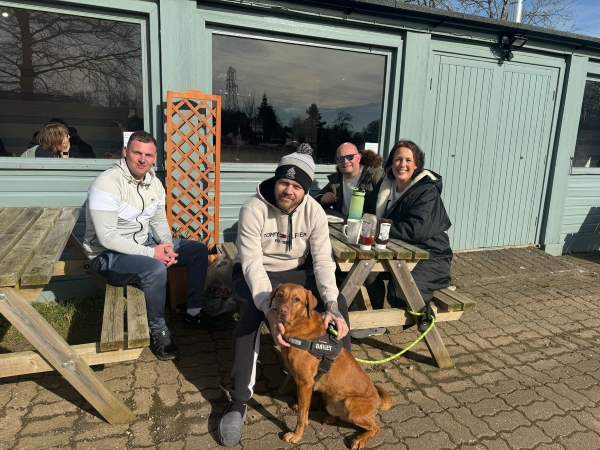 4 people and a dog sit down outside a cafe at Whitmore Lake