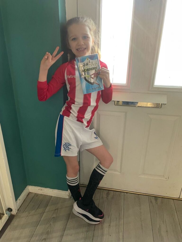 Young girl in football kit