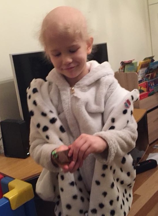 Small child wearing a bathrobe